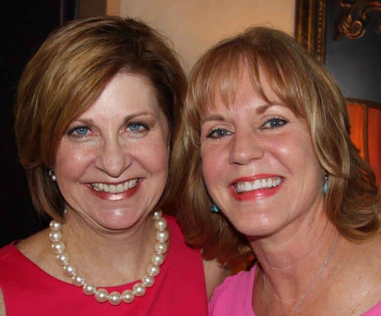 co-chairs for fashion for a passion pose together closely