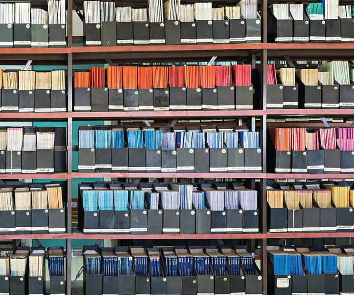 books and periodicals gathered and sorted by like colors