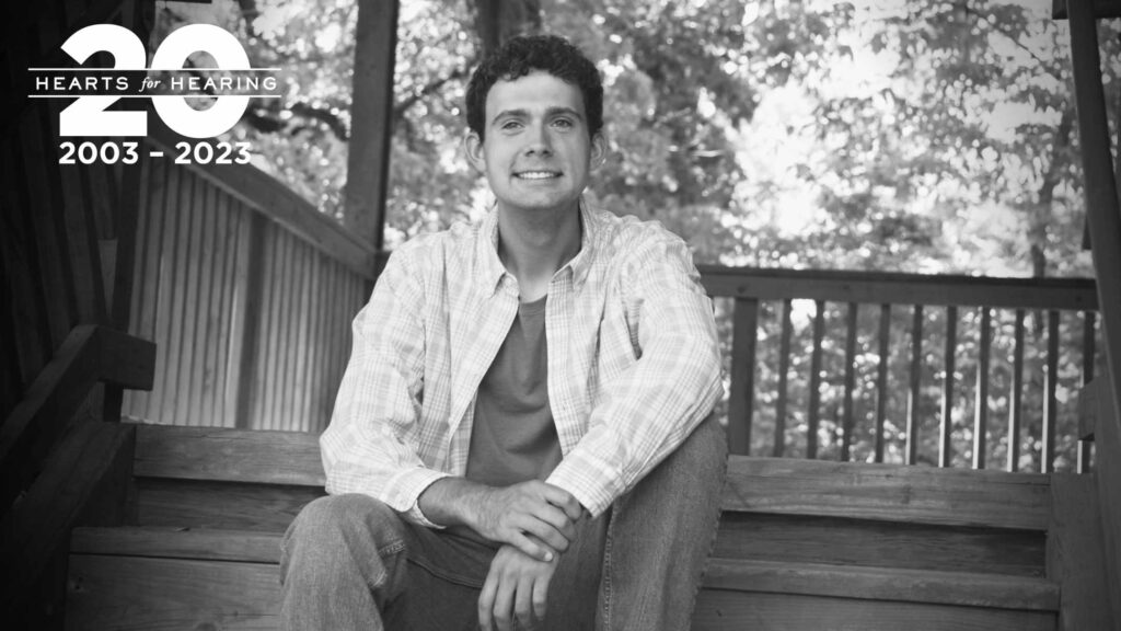 Tyler Sams sitting on stairs outside