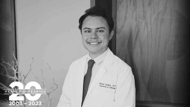 Michael Goldbeck smiles in his white coat