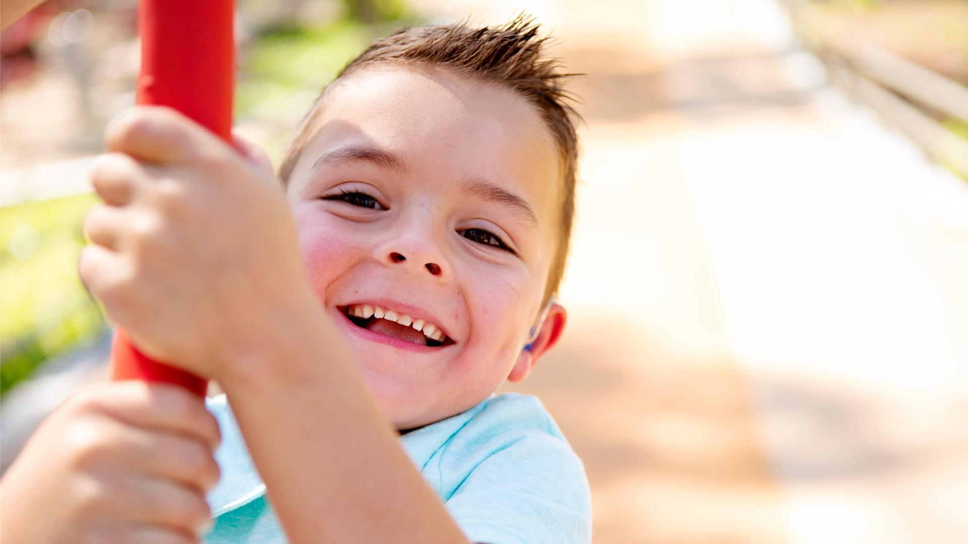 young boy smiling.